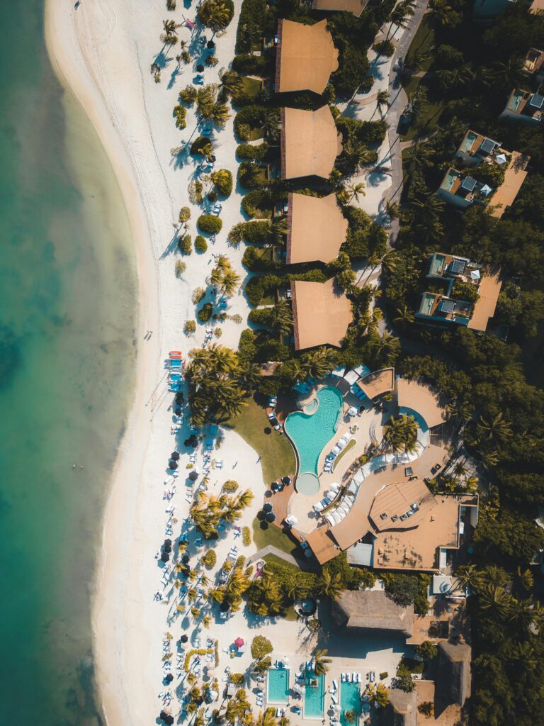 Stunning aerial view of a beach resort in Playa del Carmen, offering a glimpse of luxury and relaxation.